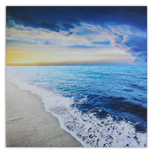 Obraz na plátně Východ slunce na mořské pláži