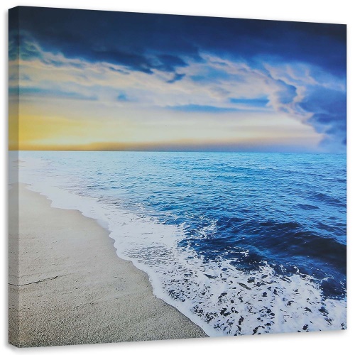 Obraz na plátně Východ slunce na mořské pláži